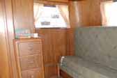 Original wood work and re-upholstered couch in 1937 Pierce Arrow Travelodge Trailer